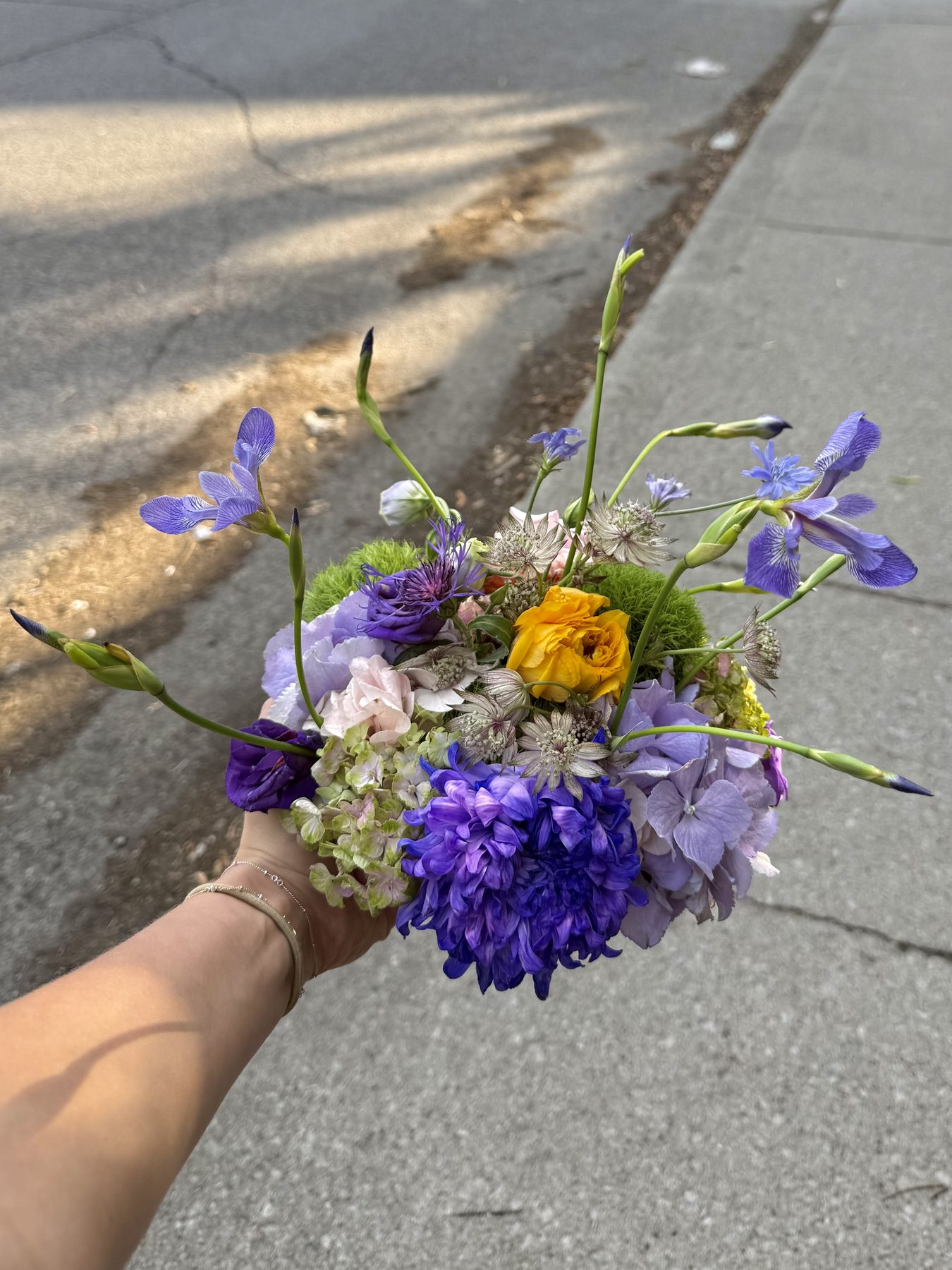 Purple, blue and yellow wildflower bouquet, close view